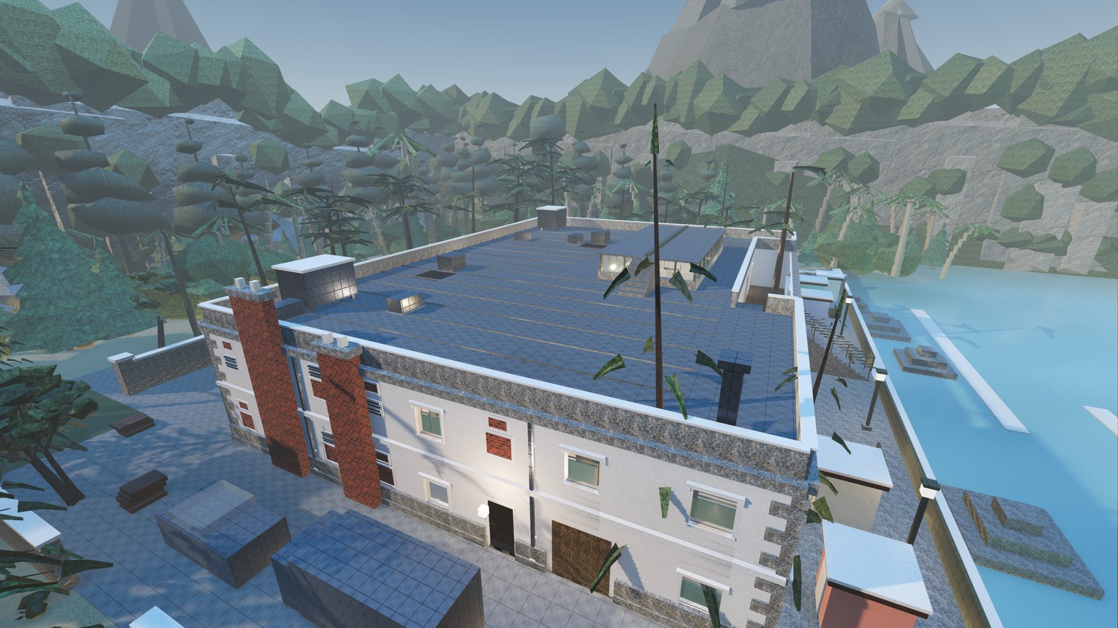Saltmarch from the air: a coastal bathhouse and spa hotel standing on a sea wall, water on three sides and wooded mountains behind